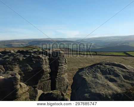 Exposed Rocks And Boulders On Bridestones Moor In West Yorkshire In Sunlight And Shadow