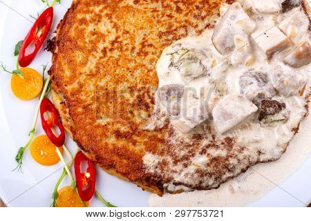 Potato Pancakes In White Mushroom Sauce. Draniki - Potato Fritters. Potato Pancakes. The Naitonal Di