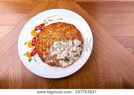 Potato Pancakes In White Mushroom Sauce. Draniki - Potato Fritters. Potato Pancakes. The Naitonal Di