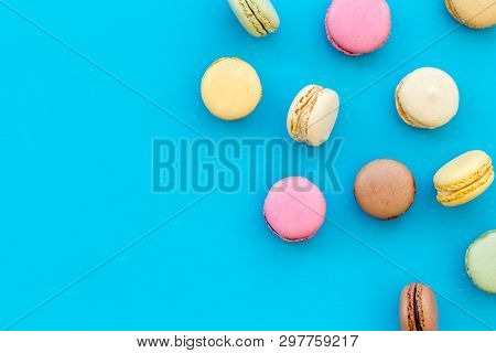Brignt Macarons For Sweet Break On Blue Background Top View Mock Up