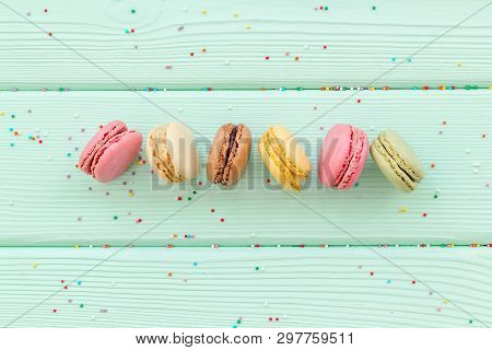 Brignt Macarons For Sweet Break On Mint Green Background Top View Mock Up