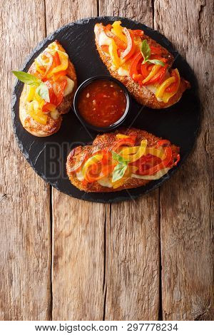 Spicy Cajun Fillet Chicken Baked With Cheese And Bell Pepper Close-up On A Board. Vertical Top View