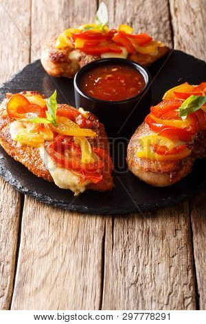 Spicy Cajun Fillet Chicken Baked With Cheese And Bell Pepper Close-up On A Board. Vertical