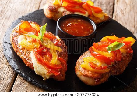 Baked Chicken Breast With Parmesan Cheese And Paprika Close-up On A Board. Horizontal