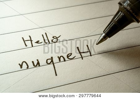 Nerd Lerning Klingon Language Writing Hello Nuqneh Word In Klingonese On A Notebook Close-up Shot