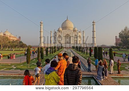 Agra, India - March 5 2018: Tourists Sighteseeing, Exploring And Admiring Famous The Taj Mahal