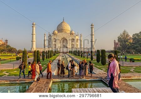 Agra, India - March 5 2018: Tourists Sighteseeing, Exploring And Admiring Famous The Taj Mahal
