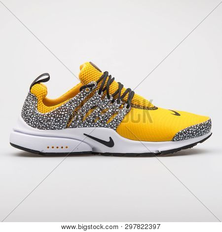 Vienna, Austria - August 7, 2017: Nike Air Presto Qs Yellow And Black Sneaker On White Background.