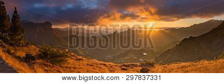 Sunset Over Gran Canaria, Spain. The Roque Nublo Is Visible On The Left Side. Tenerife Is Visible In