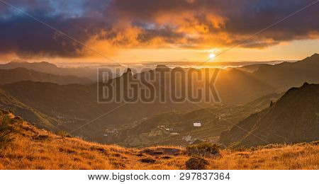 Sunset Over Gran Canaria, Spain. The Roque Nublo Is Visible On The Left Side. Tenerife Is Visible In