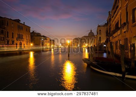 A Lantern On The Grand Canal In Venice, Italy. It Makes The Water Look, Like It Is On Fire.