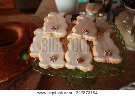 Easter Frosted Cutout Cokies On Green Glass Dish