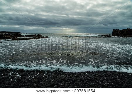 View From A Stony Shore To A Raging Ocean Wave During A Autumn Storm With A Horizon Line And Little 