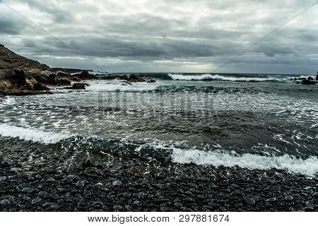 View From A Stormy Deserted Shore To A Raging Ocean During A Storm With A Clear Horizon Line And A G