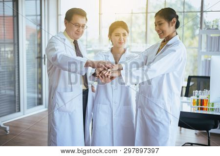 Scientists Coordinate Hands,group Of Asian People Teamwork In Laboratory,successful And Reserch Work
