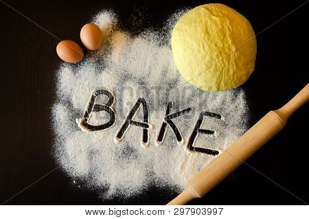 Dough And Rolling Pin On A Floury Table