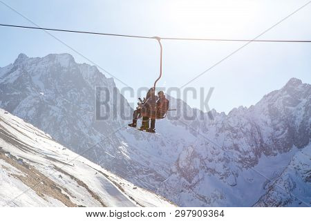 Dombai, Russia - January 3, 2014: People Are Lifting On Open Lft High Up In Caucasus Mountains