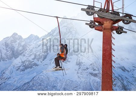 Dombai, Russia - January 3, 2014: People Are Lifting On Open Lft High Up In Caucasus Mountains