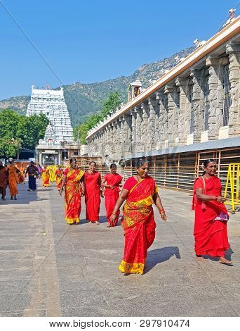 Tiruvanamalai, India - December 20, 2018: Indian women visiting the temple in Tiruvanamalai India