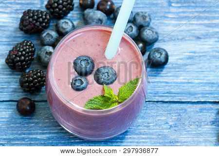 Homemade Smoothie With Fresh Blueberries On A Rustic Turquoise Background. Blueberry Smoothie On Blu