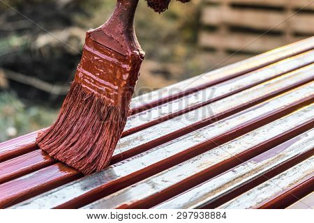 Paint Application By Brush On Metal Structures. Covering Protective Paint Metal Structures With Prim