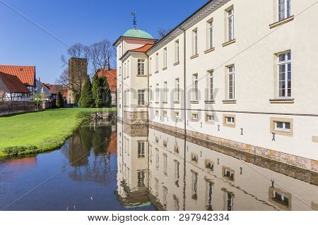 Castle Westerholt With Reflection In The Water In Germany