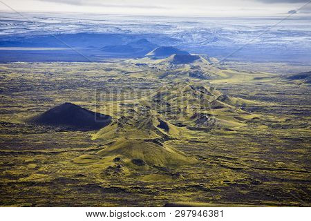 Dramatic Iceland Landscape Of Craters Of Laki Volcanic Fissure With A Green Hill And Black Lava Look