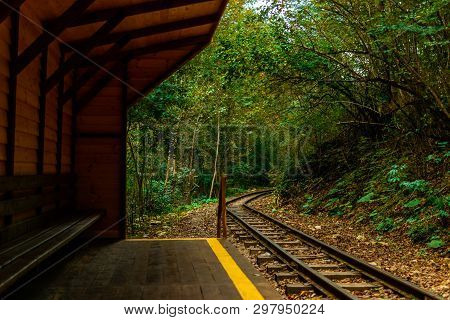 Wooden Stop In Autumn Forest For Train Railway