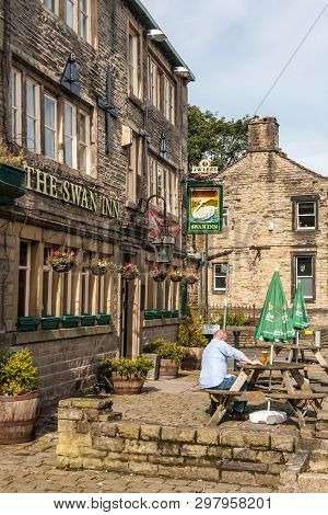 Uppermill, Oldham, Uk - September 21st 2010: Man Enjoys A Beer In The Sunshine Outside The Swan Inn,