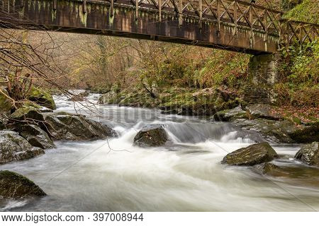 Long Exposure Of The East Lyn River Flowing Under A Bridge At Watersmeet In Exmoor National Park In 