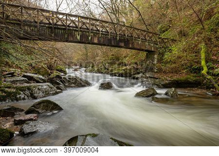 Long Exposure Of The East Lyn River Flowing Under A Bridge At Watersmeet In Exmoor National Park In 