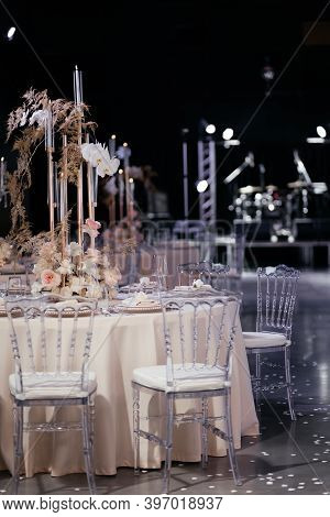 Wedding Dining Table Decorated With Flowers And Candles. Place For Guest On The Wedding. Wedding Tav