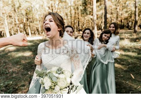Cheerful Friends Groom And Bridesmaids Hold Newlyweds In Their Arms, Cheerful Wedding, Funny Newlywe