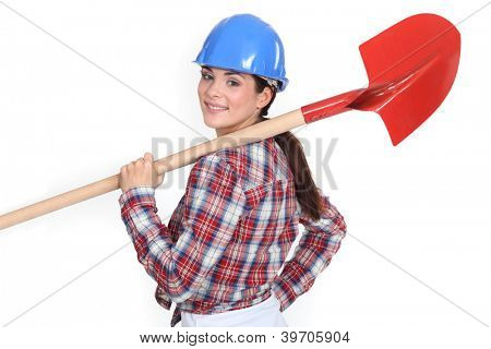 Woman holding shovel over shoulder