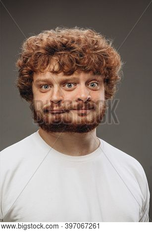 Cute, Thoughtful. Young Man With Dual Emotions Combination On Face Isolated On Dark Background, Emot
