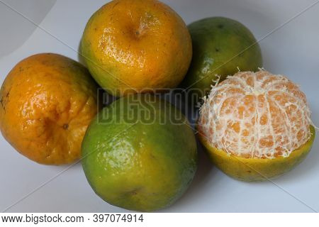 Green And Yellow Colored Orange Stock