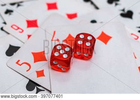 The Dice Are Laid On Top Of The Cards With A Winning Combination