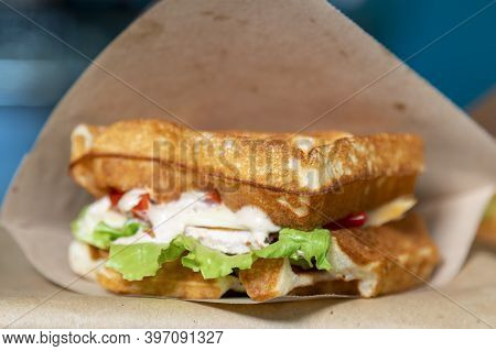 Sandwich In A Paper Bag Close-up. Sandwich Filet Americain, Close Up Of Burger. Fast, But Unhealthy 