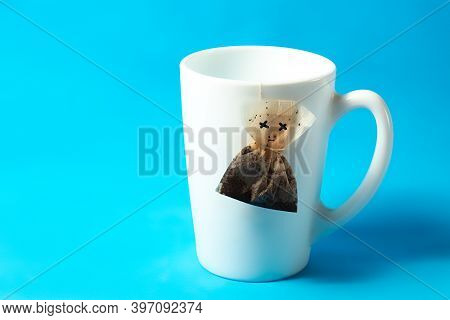 Tea Bag, Weighs, Died. On A Blue Background