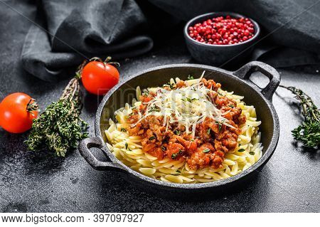 Bolognese Pasta, Risone With Ground Beef In A Plate. Black Background. Top View