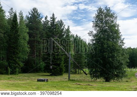 Vintage Russian Well-pie In The Pushkin Mikhailovskoe Summer Cloudy Day