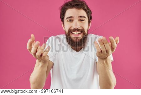 Man In White T-shirt Tinplate Hands Emotions Pink Background