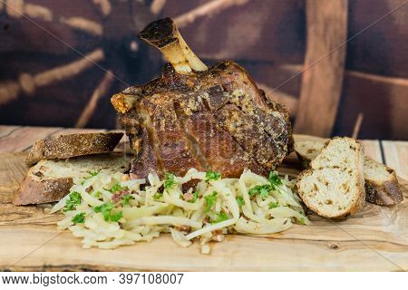Pork Knuckle With White Cabbage And Bread