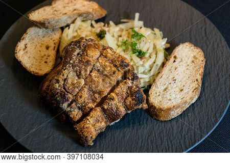 Pork Knuckle With White Cabbage And Bread