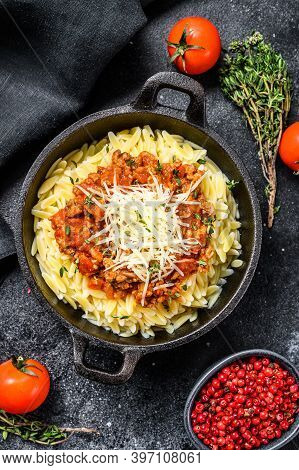 Orzo Pasta, Risone With Bolognese Sauce And Ground Beef. Black Background. Top View