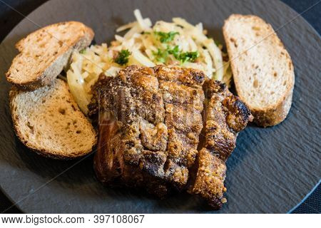 Pork Knuckle With White Cabbage And Bread