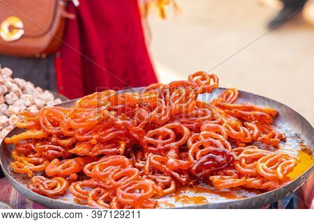 Fresh Jalebi Sweet Snack Outdoors In A Bazaar.
