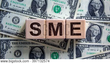 Sme Concept. Word 'sme - Small And Medium-sized Enterprises' On Cubes On A Beautiful Background From