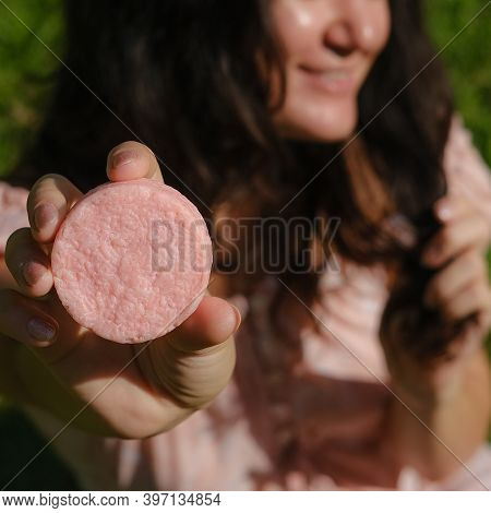 Young Woman Holding Natural Eco Friendly Solid Shampoo Bar, Conditioner Or Soap. Zero Waste And Sust
