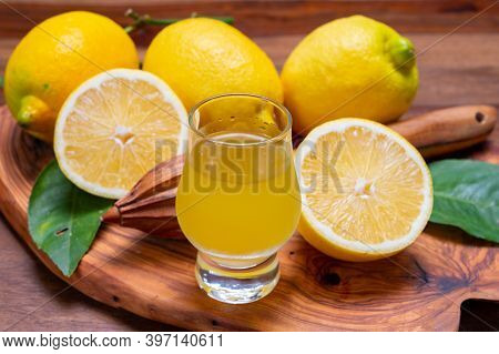 Ice Cold Sweet Limoncello Liqueur Made From New Harvest Of Fresh Ripe Yellow Italian Lemons, Amalfi